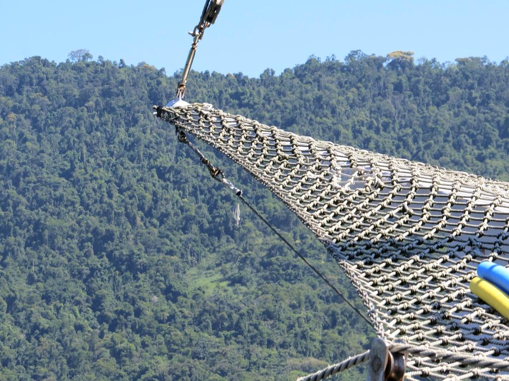 Traveler consulting travel resources on a digital tablet at airport lounge